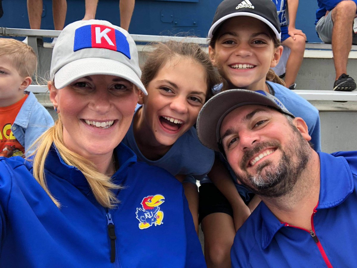 BHanni's tweet photo. Today’s #KUCancerFighter hero is Katie Gates of Lawrence. This brave mother of 3 initially beat breast cancer 5 years ago but now is facing more cancer-related surgeries next month. Her favorite Jayhawk is Danny Manning. Katie, Bill Raftery &amp; all of Jayhawk Nation is behind you! https://t.co/qmn93WtLXz