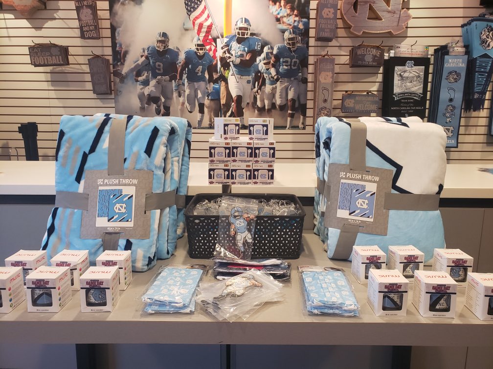 GoHeelsGameDay's tweet photo. Mandatory 😷 wearing inside Kenan Stadium. Bring your own and you can buy #Carolina themed masks & some great new items 🧢 👕 🕶 from our merchandise partner @dyehard_fans at Gate 3 and in the Blue Zone.
#GoHeels
#BeTheOne | #TogetherWin https://t.co/ZzgyNLXkNM