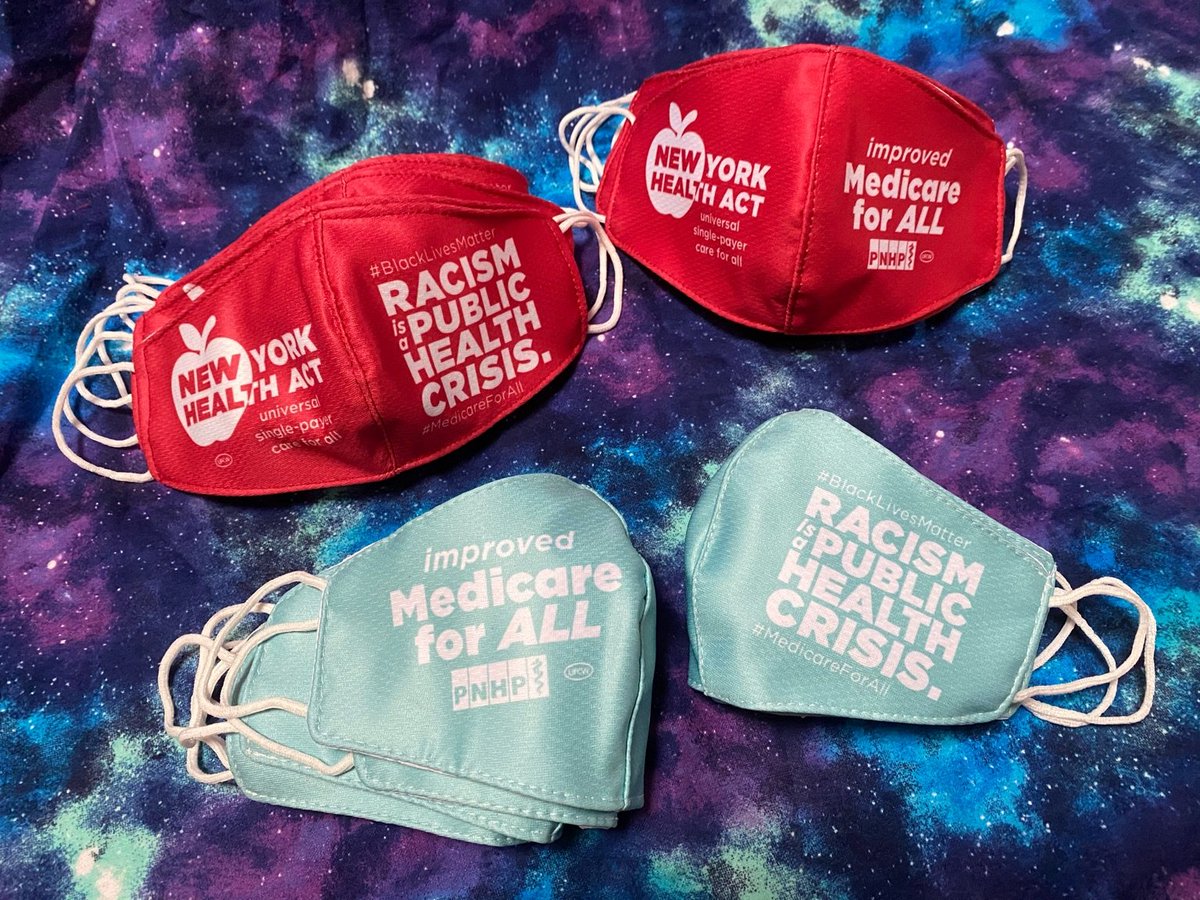 Four sets of face masks are laid on a background of blue/purple/white galaxy print. Left side of both red masks say "New York Health Act universal single-payer care for all" Right side of red mask says "#BlackLivesMatter Racism Is A Public Health Crisis #MedicareForAll" The right side of second red mask says "improved Medicare For All" and has a white and red PNHP logo and white union bug. The light green/blue mask says "improved Medicare for All" on the left side. The right side says "#BlackLivesMatter Racism Is A Public Health Crisis. #MedicareForAll" Each mask has white ear loops. 