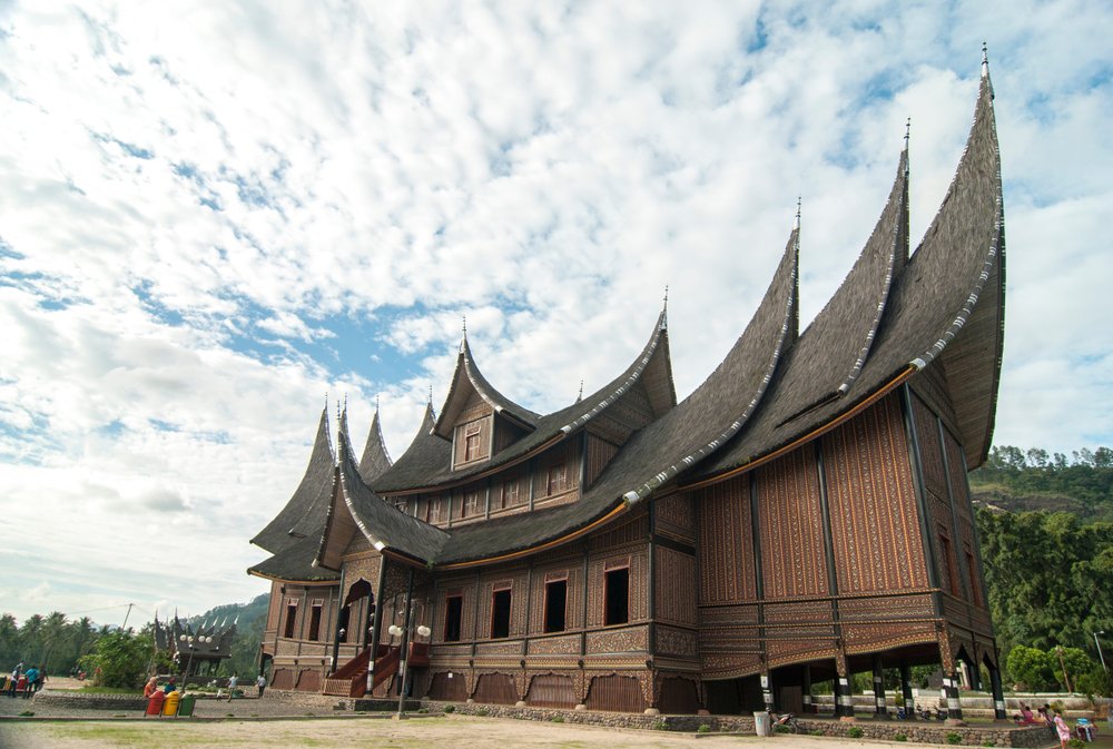 Rumah Gadang (Indonesia)Native to the Minangkabau people of West Sumatra, these homes are notable for their multi-tiered upswept gables and are decorated with intricate floral carvings and patterns. Traditionally these homes were passed down matrilineally, from woman to woman.