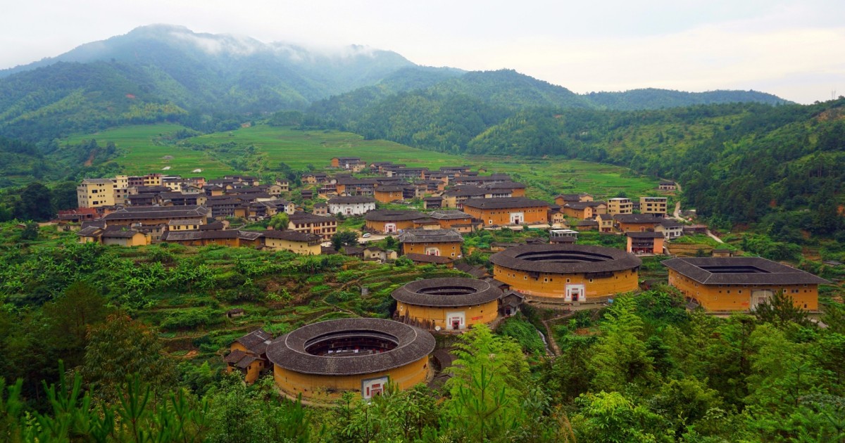 Fujian Tulou (China)Built between the 12th and 20th century in Fujian by the Hakka-Chinese, with the intent of fortifying their living space against potential conflicts with their neighbors. They are known for their egalitarian design with all sub-units around the same size.