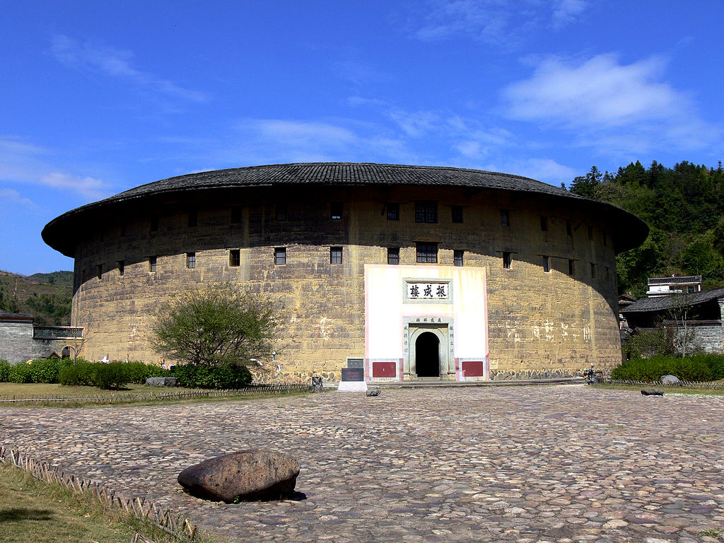 Fujian Tulou (China)Built between the 12th and 20th century in Fujian by the Hakka-Chinese, with the intent of fortifying their living space against potential conflicts with their neighbors. They are known for their egalitarian design with all sub-units around the same size.