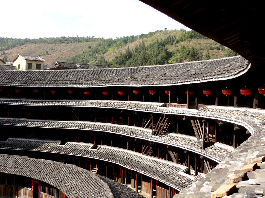 Fujian Tulou (China)Built between the 12th and 20th century in Fujian by the Hakka-Chinese, with the intent of fortifying their living space against potential conflicts with their neighbors. They are known for their egalitarian design with all sub-units around the same size.
