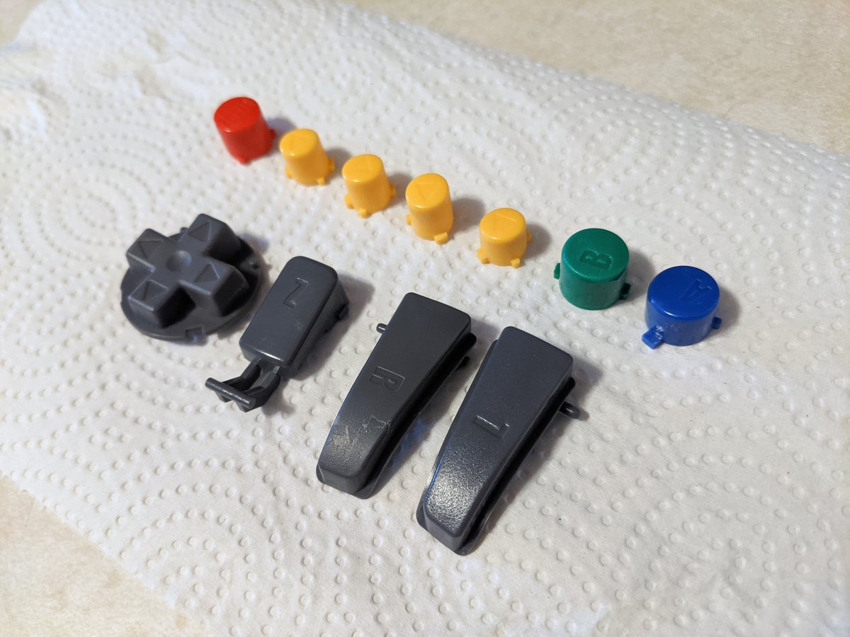 gamrjerome's tweet photo. Tried out some #n64 button dying. Not the final look of my #Steelsticks64 controller I but wanted to see what black buttons would look like. Turned out well. https://t.co/Jh2fmrjokd