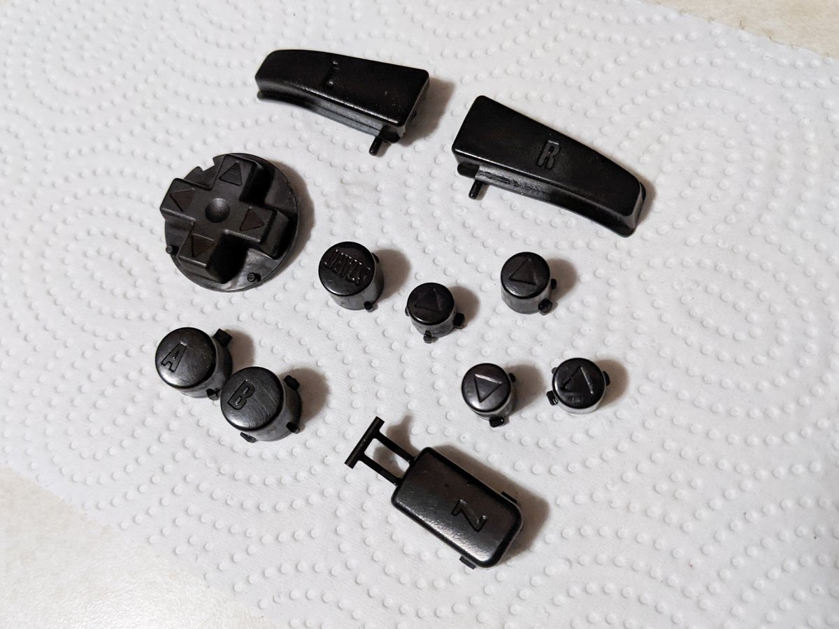 gamrjerome's tweet photo. Tried out some #n64 button dying. Not the final look of my #Steelsticks64 controller I but wanted to see what black buttons would look like. Turned out well. https://t.co/Jh2fmrjokd