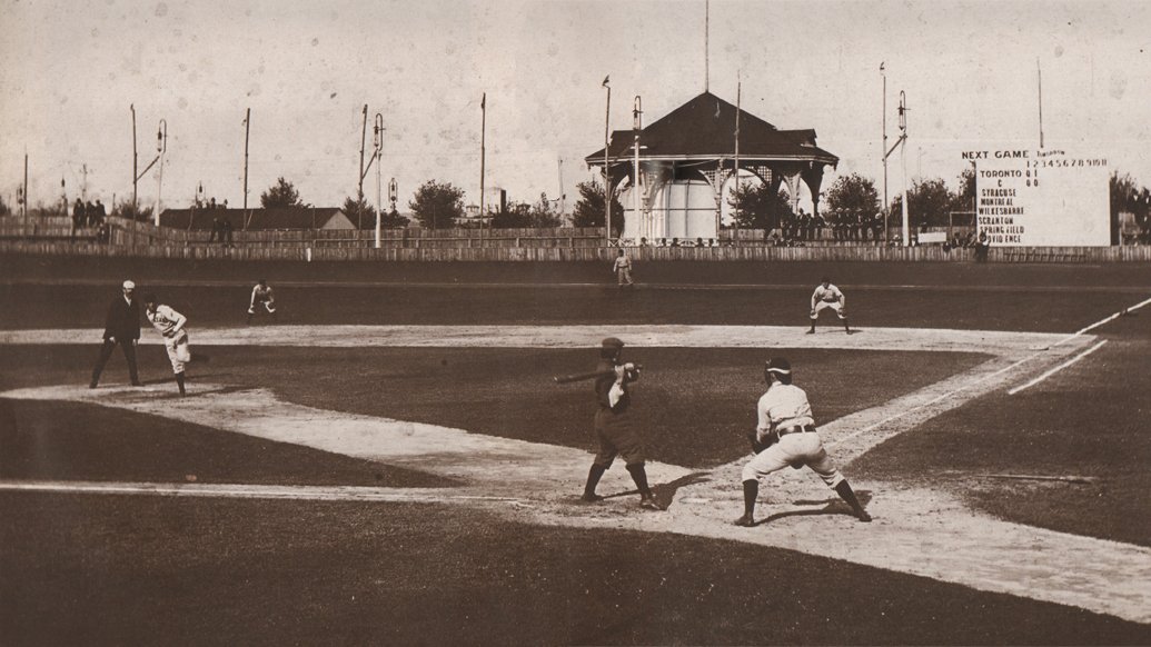 12. In this game played at an earlier version of the Hanlan's Point Stadium in 1897, you can still see evidence of the old Victorian era rules.The umpire stood behind the pitcher. And there was no mound either — the pitchers threw off flat ground: