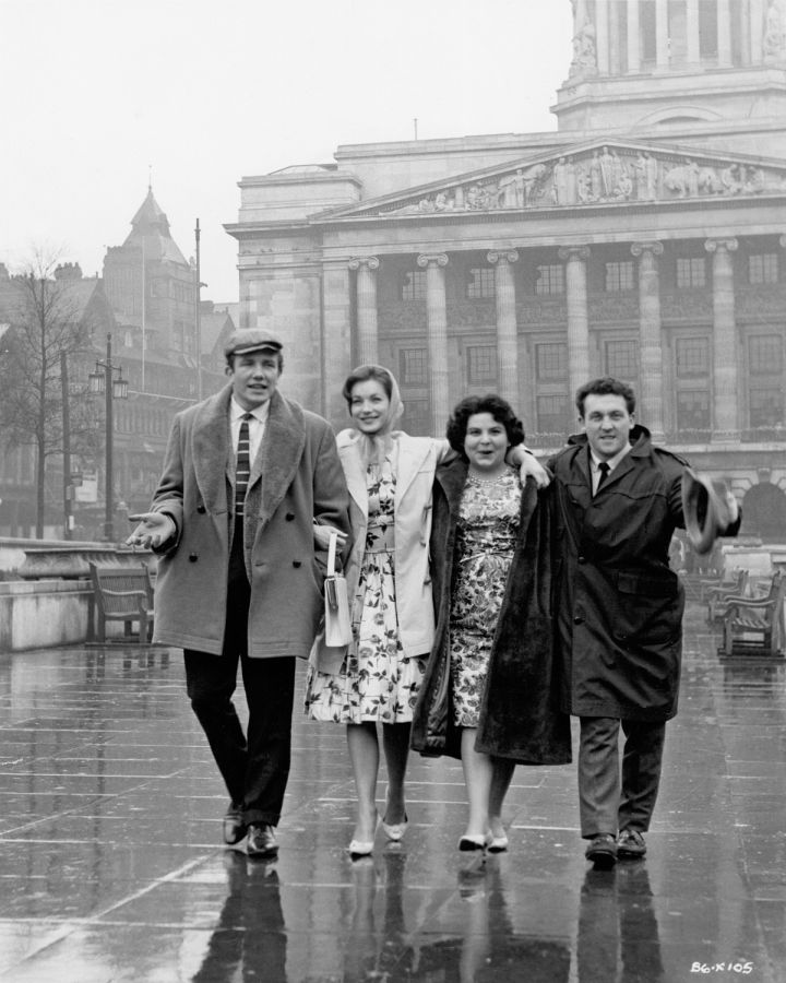 "Have you seen her, Ron? A bit of all right, or what? Looks like your Marjorie, not that you'd ever get her away from that rough house bloke.""I've got Marjorie waiting at home, Tubby. She'll be slicing up the cucumber and putting it in a glass bowl of vinegar as we speak."