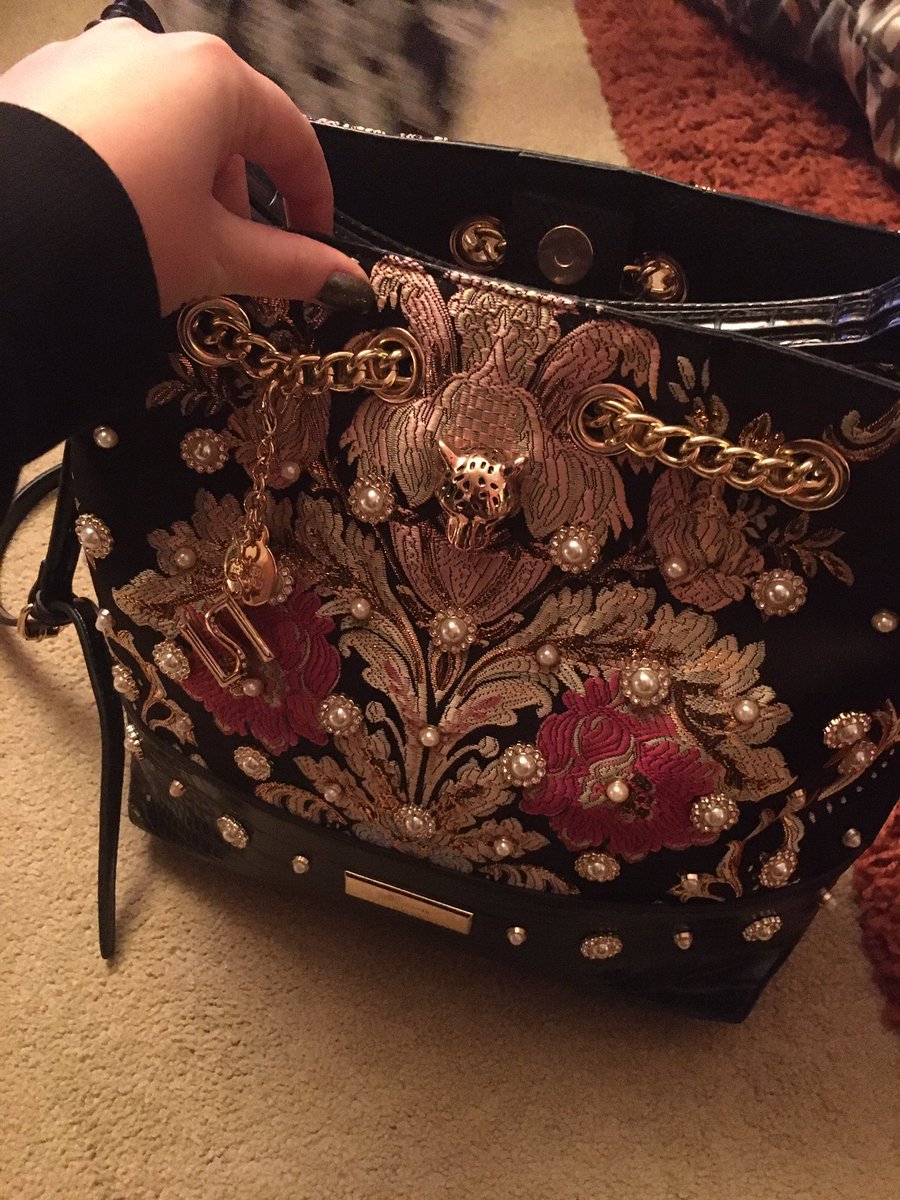 This woman’s dress off strictly is the exact same as my river island bag???? I’m so confused