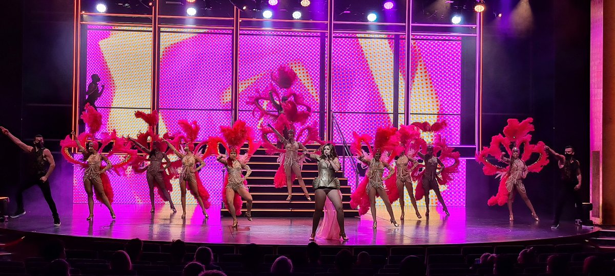 NickWeirShowbiz's tweet photo. It’s early days and a long road ahead, but LIVE SHOWBIZ IS BACK! The #Showgirl returns to Planet Earth! The entire entertainment industry is in this together and we fight as one. #RoyalCaribbeanProductions is proud to be out front, taking some of the first steps. #makingmaskssexy https://t.co/U5zDH3OMWM