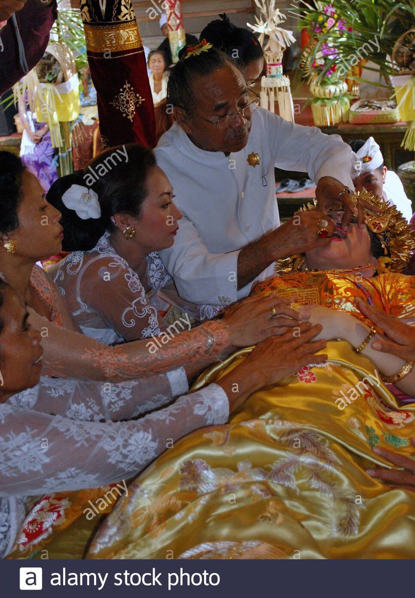 TW / self harmIn the first photo, it’s during a performance called Ngurek, participants will self-harm themselves. They believe that no matter what happens, God will protect them from harm. The second photo is a teeth-cutting ceremony.Credit to: Putu Bagus / Culture Trip