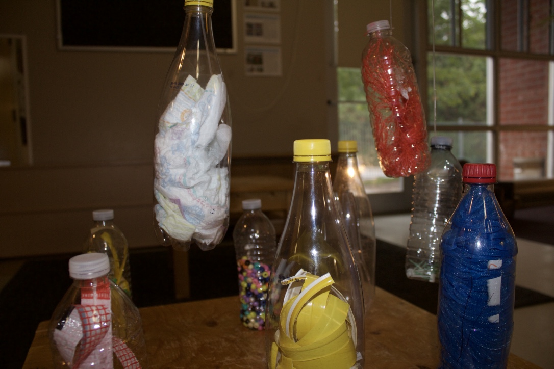 100s of plastic bottles suspend from ceiling, sit on shelves & gather in corners of the plastic classroomExaggerating plastics presence invites rituals of care with & between usEthical entanglement  #livingwithplastic  @DiscardStudies  #Discard2020  @vpacinik  @common_worlds 6/10