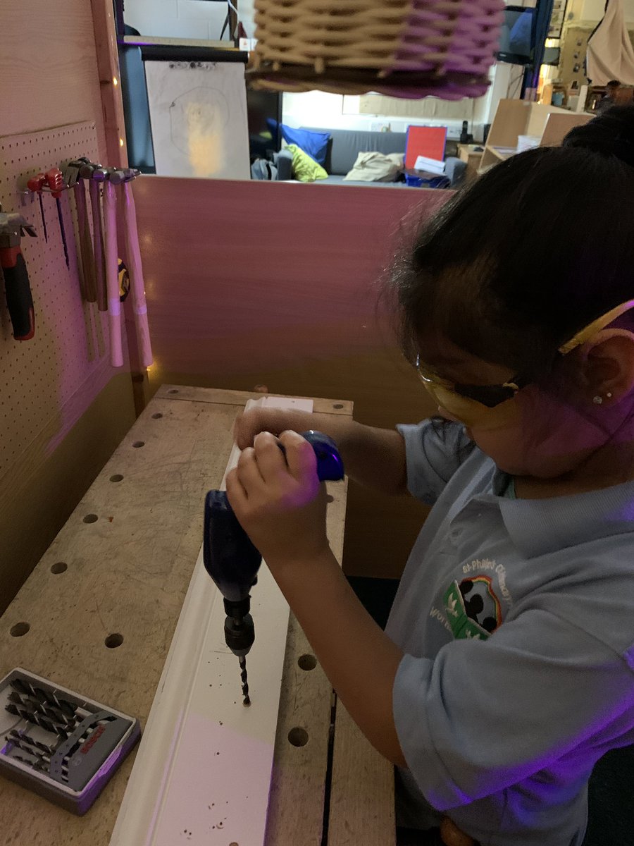 EYFSatStPhilips's tweet photo. A.  Adjusts the drill chuck to accept a larger drill bit having progressed through the sizes of the bits to make her hole bigger.  She cuts her next piece of wood using the tenon saw and then measures the length of her wood using a tape measure #Woodworking @STPHILIPSCE https://t.co/i1YXTxbRPb