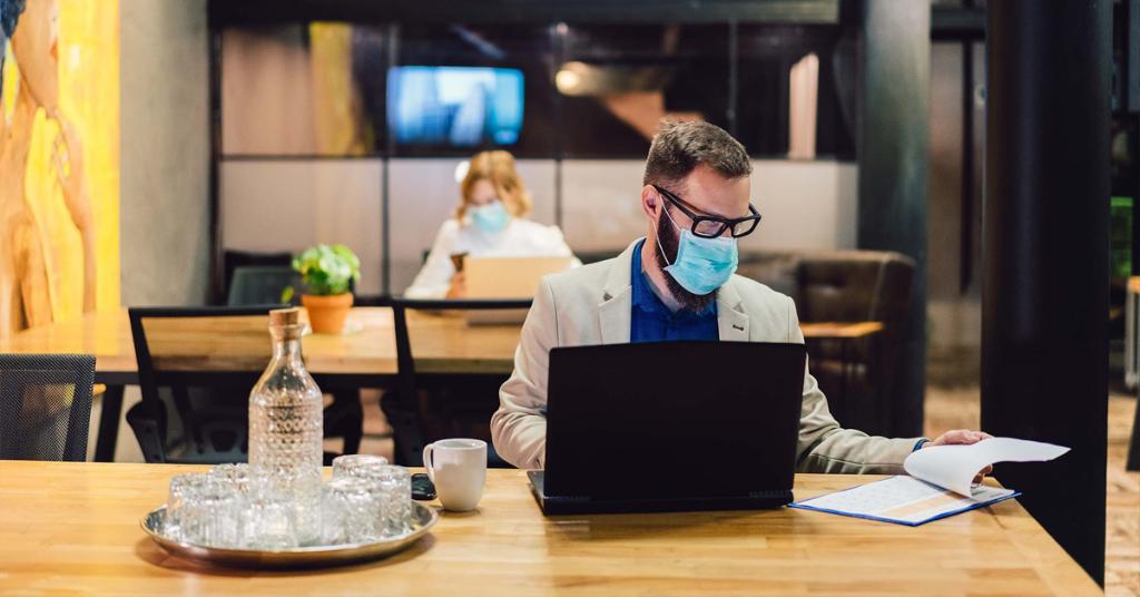 Office worker working in mask