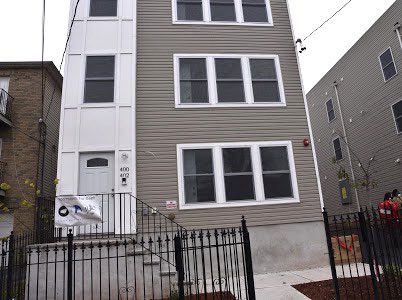 City of Newark dignitaries and Ascension Capital Partners Siree Morris and Ryan Curran cut the ribbon today for two new affordable three-family homes on former city-owned vacant lots, as part of Mayor Ras J. Baraka’s plan to create more affordable housing.