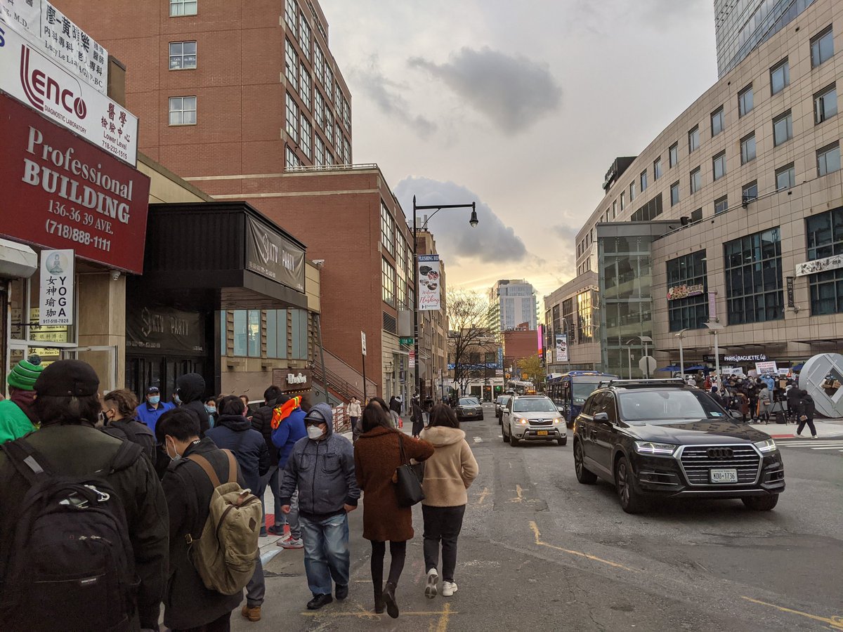 Dualing pressers in Flushing today about a controversial waterfront rezoning project. Left side is  @MinKwonCenter and others, right side of 39th ave are  @CMPeterKoo supporters.