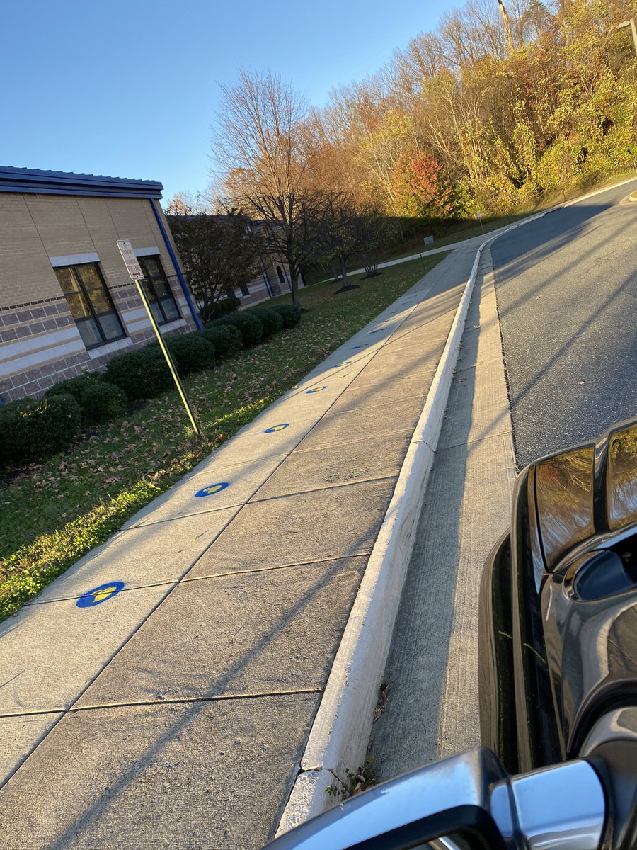 SCJenRyan's tweet photo. I haven’t tweeted in a LONG time. Yesterday I spent the day making these socially distancing circles for the kids to wait on for the bus. I might be super sore, but the smile on the kids faces was worth it @SwansCreekES. Even got some paint on my lips. #WeAreSwans https://t.co/ADL7pr0XWc