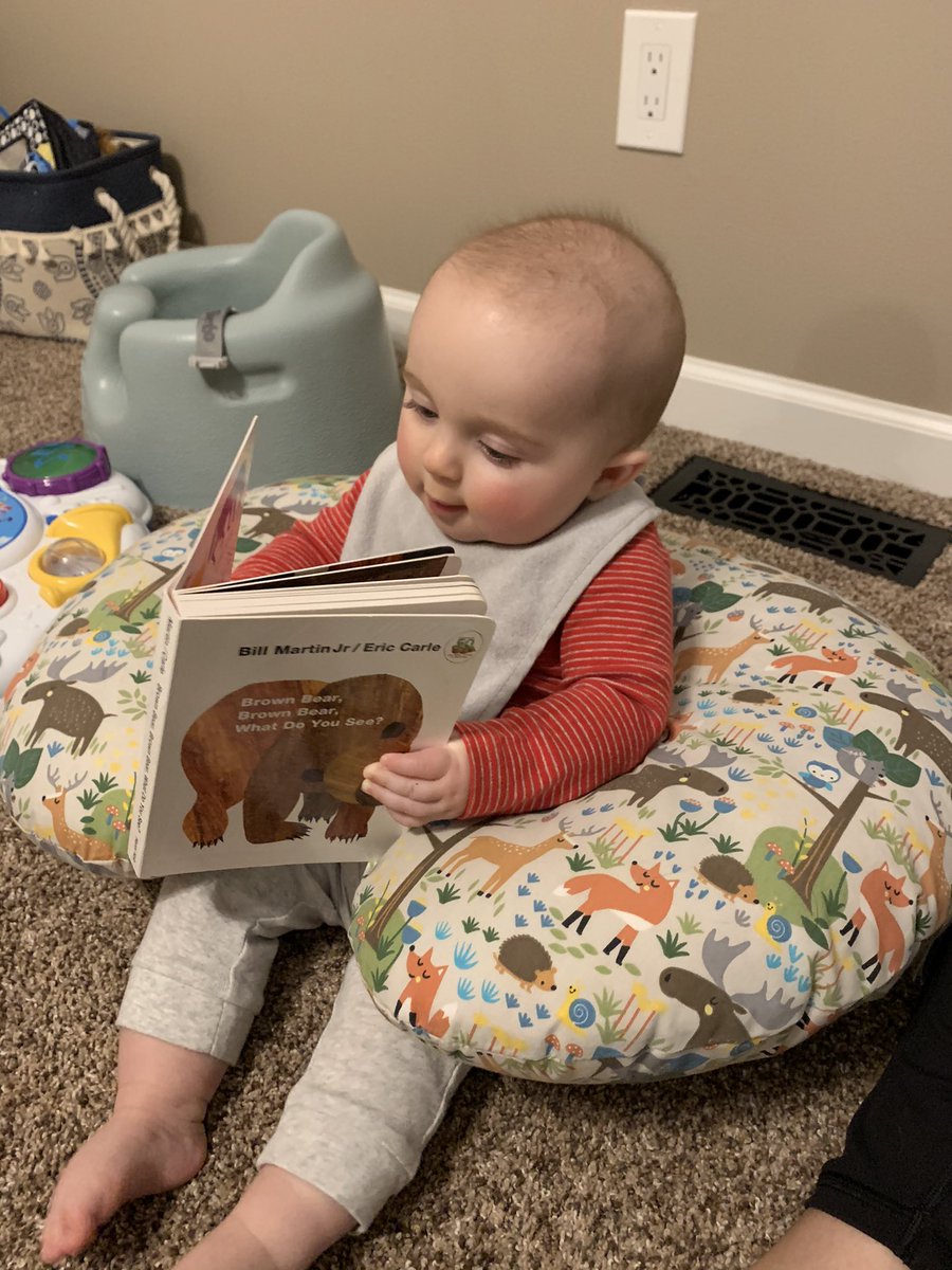 Be still my heart. He likes books!! #littlereader #readingisfundamental #startearly