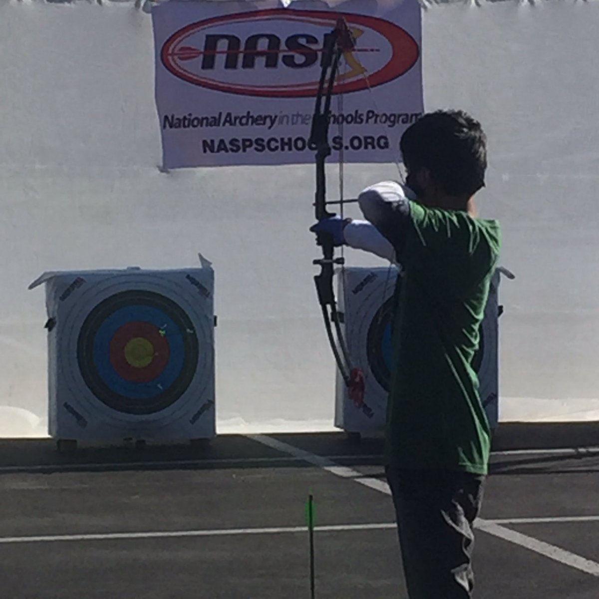 CoachMcDonald_'s tweet photo. Thank you Bass Pro for your generous donation to the National Archery in Schools Program! A shout out to Jarrett Archer, Jose Castillo, who participated in the celebration.  Great job Jose! @JarrettTrojans https://t.co/D5V5trU778