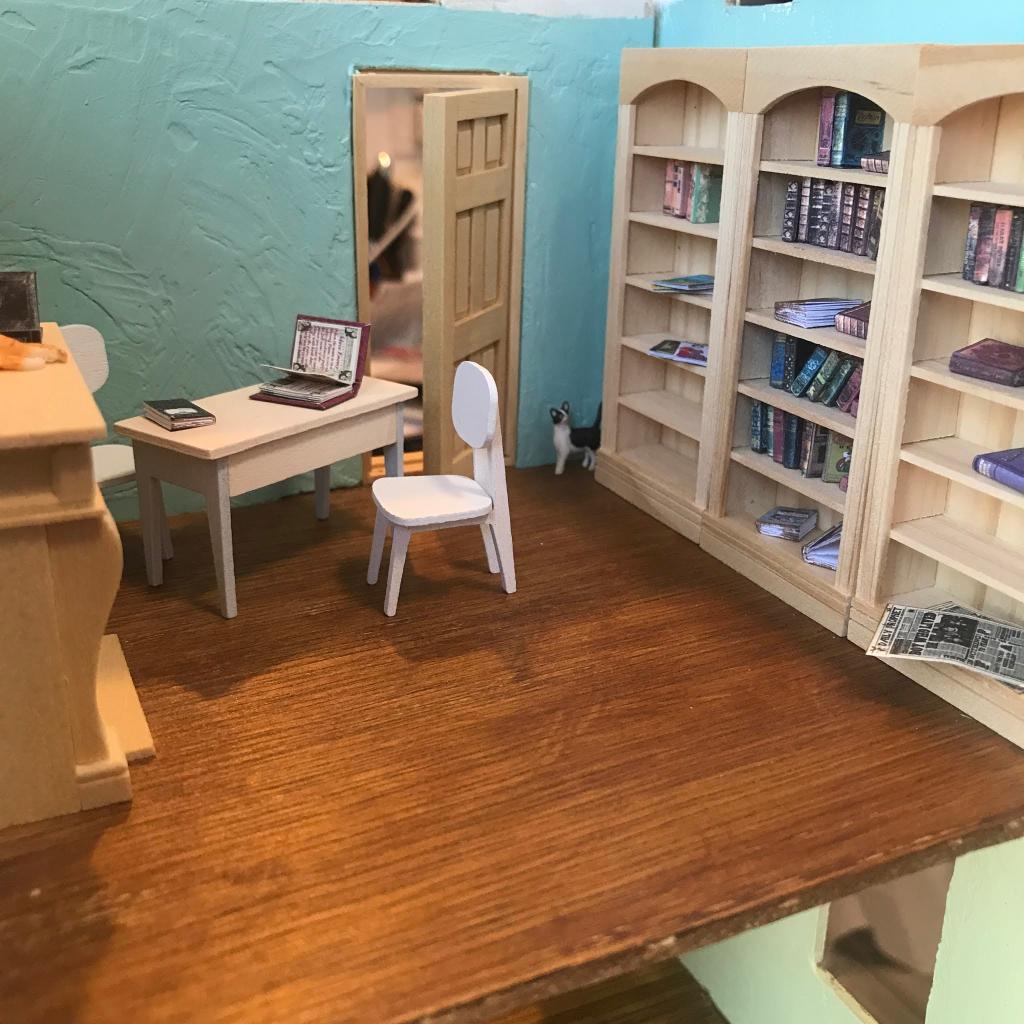 SCU_Library's tweet photo. Judy, Library Supervisor, enjoys working on creative projects! Currently, she’s building a miniature house. Swipe to see how small everything is in comparison to a push pin! 🏠 📌 #LibraryStaffPicks https://t.co/FubaCjoWfP
