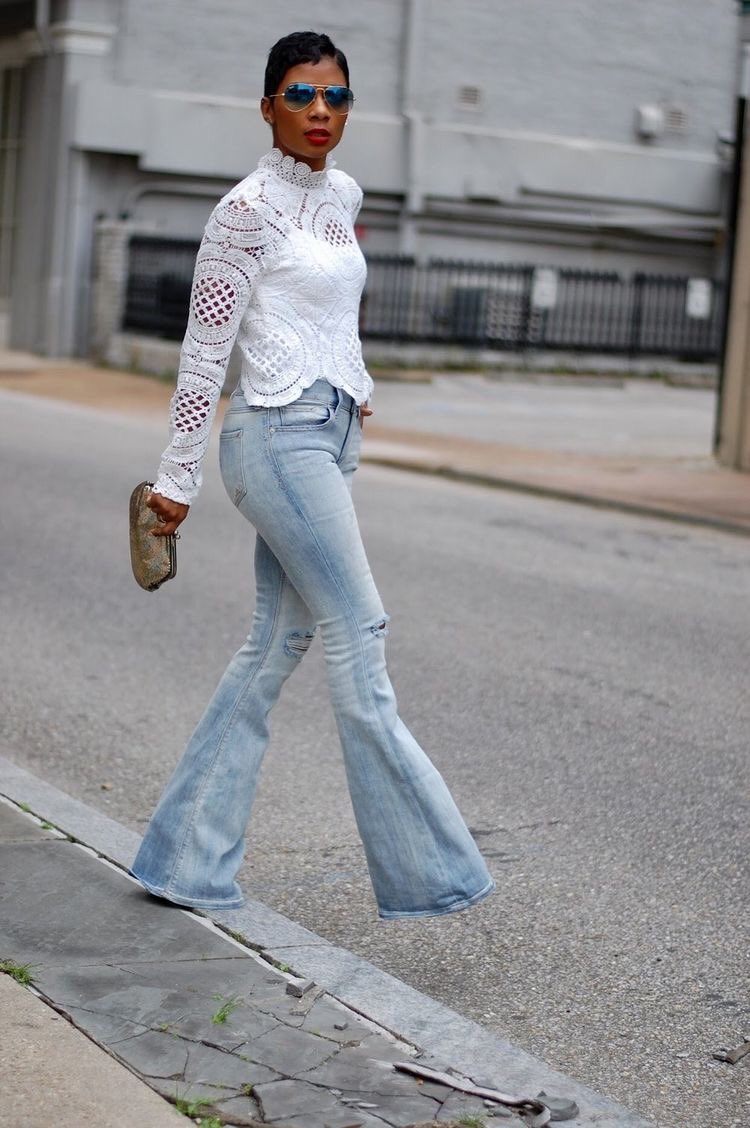 3. Wear with a pretty blouse, loose or not. Tuck it halfway in or totally. This can help balance your proportion and draw attention to your upper body if need be.