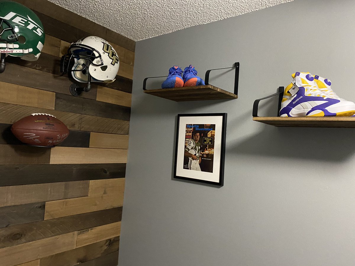 Gym flooring down. Shelving and memorabilia is up. All super sentimental stuff.