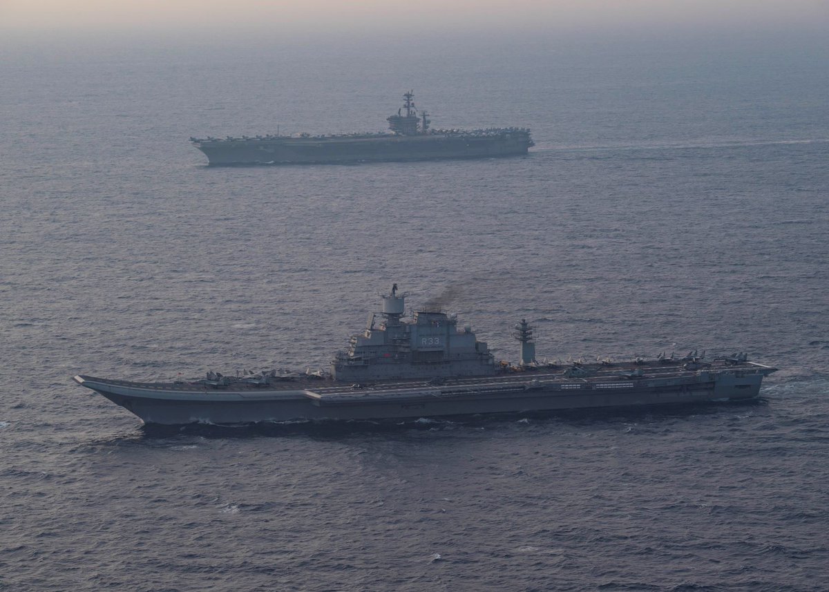 Wot a view for your  #WarshipWednesday -- onetime antagonists made friends by fate. That is CVN 68 back there and we know it well but up forward here is a verrrrry interesting ship: India's INS Vikramaditya, once the Soviet Navy's own "aircraft cruiser" Baku. Pic by MC3 Schaudt