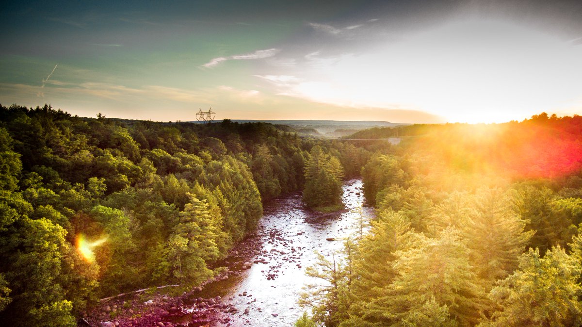 mseigz's tweet photo. A beautiful sunset over the Black River in central NY to distract you from the ugliness we are bombarded with on the daily! #photography #NaturePhotography #dronephotography #sunset https://t.co/dxIlKBlADO