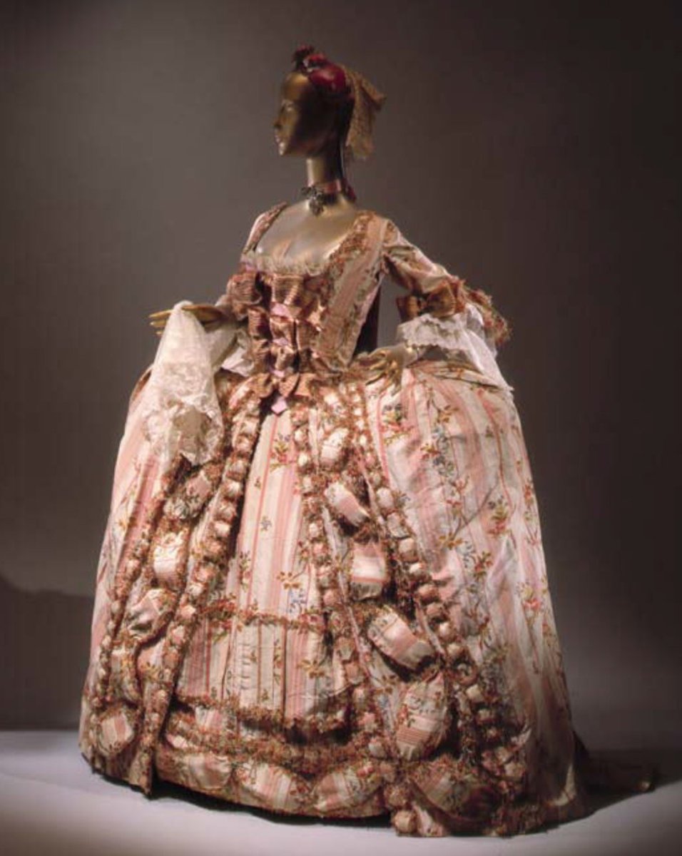 Dresses modeled on the classical Greek form increasingly replaced the wide hoop skirts associated with Marie Antoinette and her courtiers.