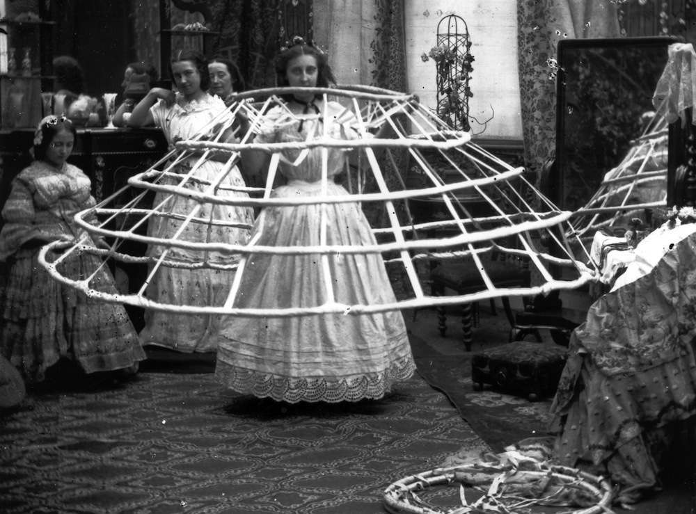 Staged photographs showing women wearing exaggeratedly large crinolines were quite popular, such as a widely published sequence of five stereoscope views showing a woman