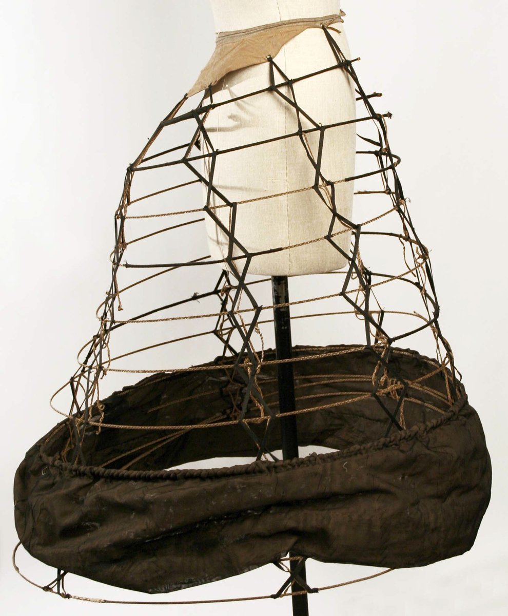 As the fashion for crinolines wore on, their shape changed. Instead of the large bell-like silhouette previously in vogue, they began to flatten out at the front and sides, creating more fullness at the back of the skirts (sometimes called eliptical crinolines).