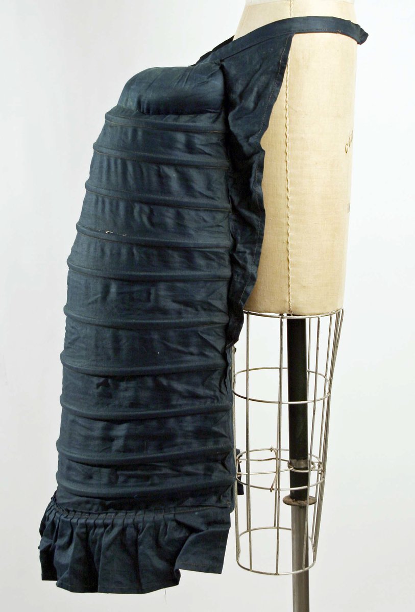 Crinolettes were more restrictive than traditional crinolines, as the flat front and bulk created around the posterior made sitting down more difficult for the wearer.