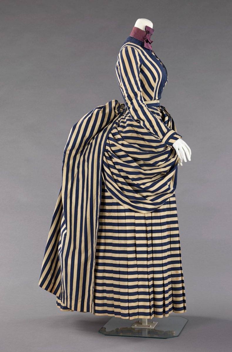 The bustle later evolved into a much more pronounced humped shape on the back of the skirt immediately below the waist, with the fabric of the skirts falling quite sharply to the floor, changing the shape of the silhouette.