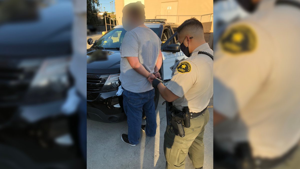 Deputy arresting a man during a prostitution human trafficking sting.