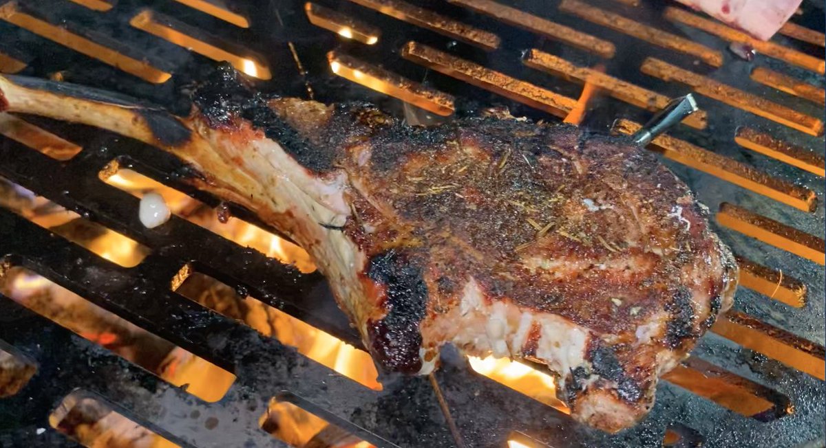 Veal tomahawk over a wood fire. When you spend this much on meat, you want to cook it to the right temperature. That’s why I’m using <a href="/MEATERmade/">MEATER</a> wireless thermometer. Perfect doneness every time and you control it from your phone.

#grilling #cooking #bbq #recipes