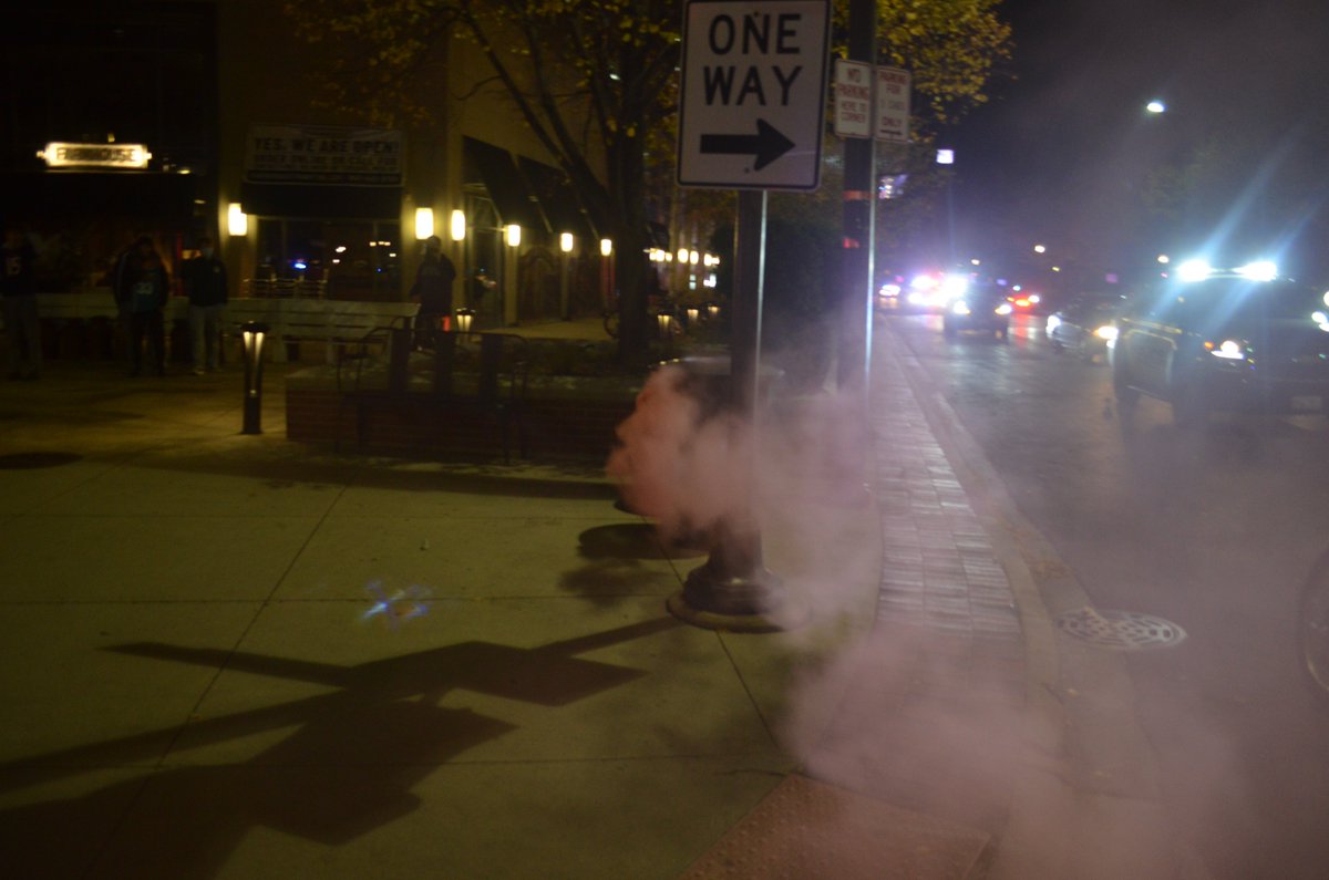 One "smoke bomb" was dropped in a trash can as students marched. A couple students held one or two more above their heads as they marched.