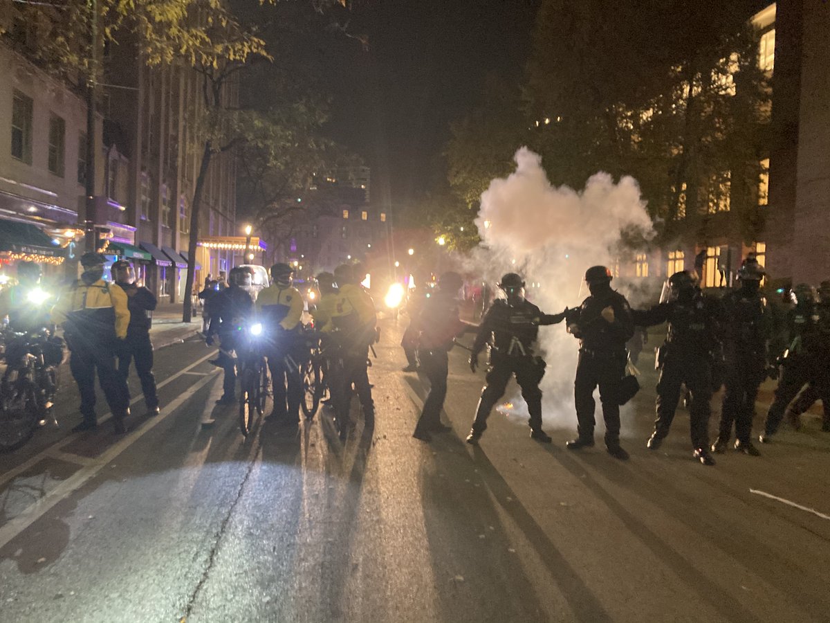 "students were throwing fireworks and smoke bombs at police officers"-As students marched, 1-2 protesters occasionally released firecrackers onto the sides of the streets.-After arrival of NIPAS in riot gear, 1-2 fireworks were thrown in the direction of police (pictured):