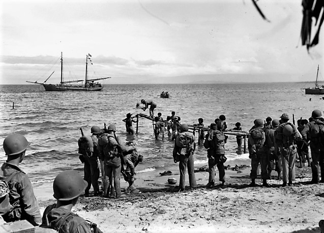 With the Orokaivas’ help, the GIs struggled through each night without rest in order to move again before daylight. Here the young men from Wisconsin and Michigan, the most advanced nation in the world, put their trust and lives in the hands of these skilled local village men.8/