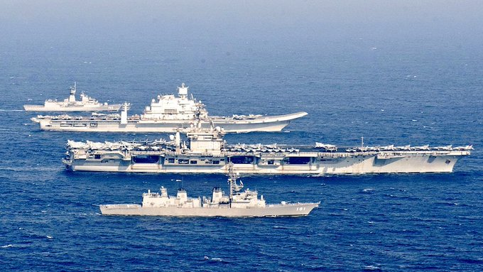 Looking at these images of the Vik sailing alongside the Nimitz, a few things stand out:1. The Vik has a *massive* island—much larger than the Nimitz's. On a small carrier, that eats up precious deck space.