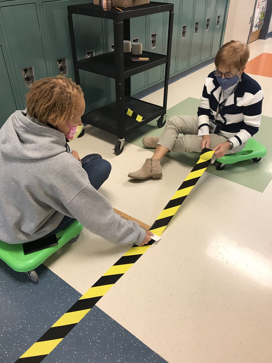 TMStiger1's tweet photo. Many Tiger Paws make light work! Thanks Ms. Gasway and Ms. Snowden for laying down the hallway dividers! #Toano #wjccschools https://t.co/DrgJnvsaBt