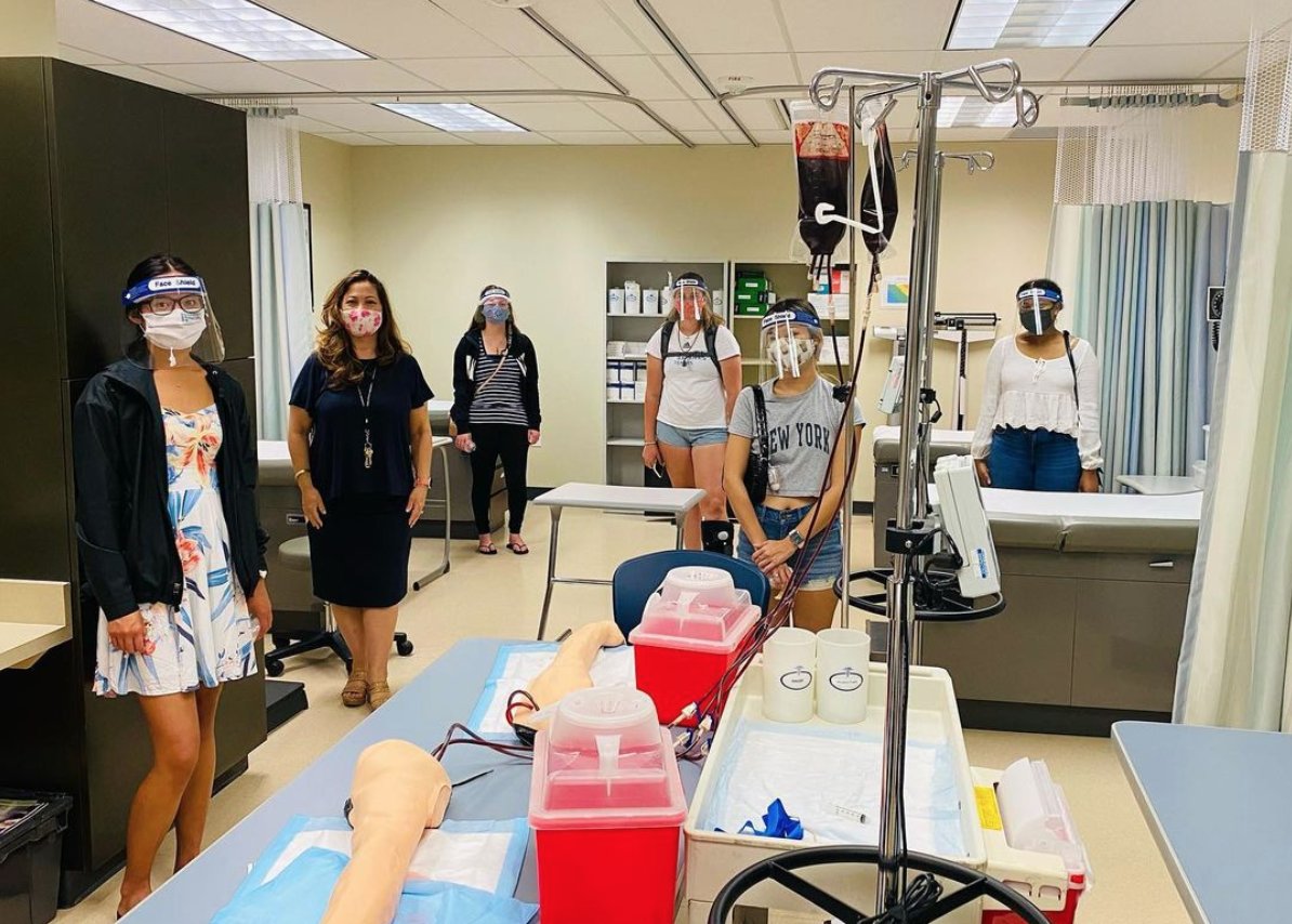 HPU's tweet photo. This is what hands-on learning looks like at HPU! Nurse Scholars participate in their first lab simulation and learn about PPE with Dr. Sandra Bourgette-Henry, our Nurse Scholars Coordinator.  #HPUnursing #RN #BSN #nursing #simulation #Hawaii #HawaiiPacificUniversity https://t.co/hhZVkrvcsP