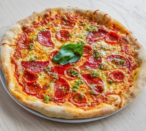 Comment your favourite pizza toppings below👇 Our choice for today is some spicy salami, parmesan cheese and a bit of green pesto🤤