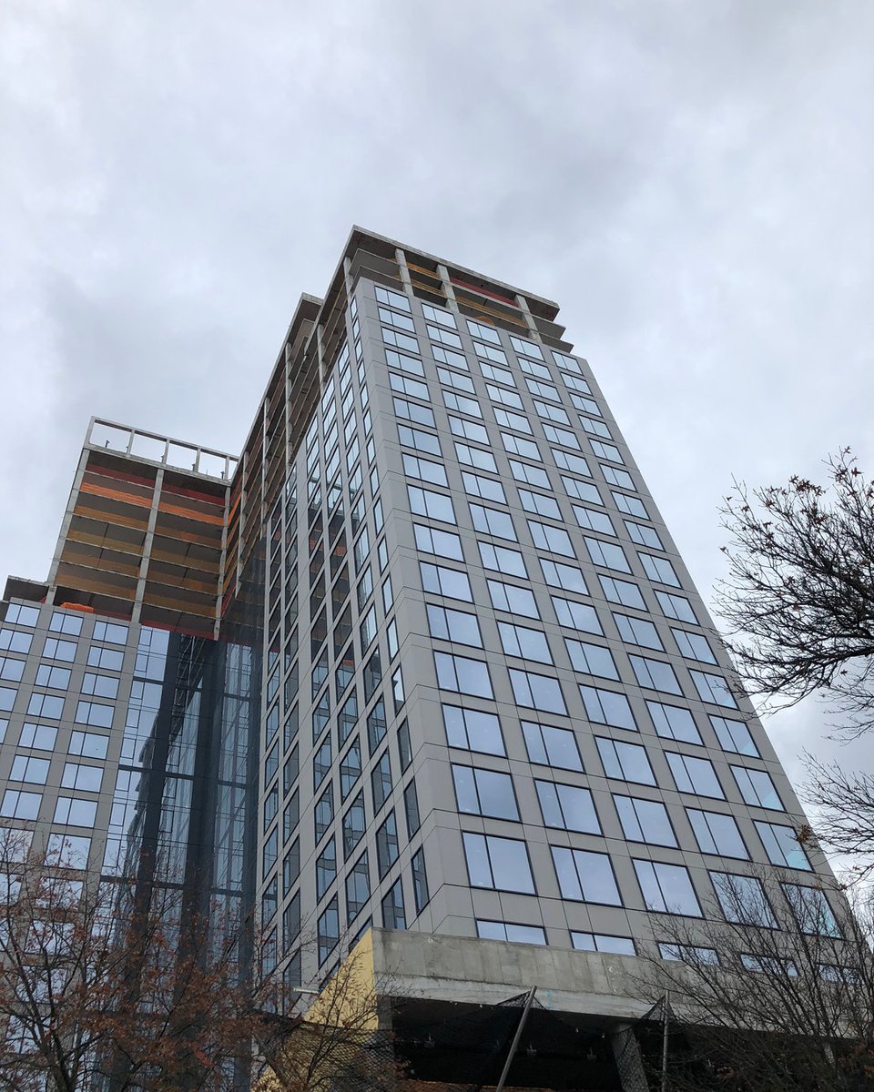 BBBarch's tweet photo. Skylines: At 14 LeCount Place, the construction crane is down & installation of the curtain wall continues on the 21st floor! Pictured is the first of two glass & masonry towers featuring housing and retail that will provide 180-degree views of the Long Island Sound and NYC. https://t.co/rzmFqhNOgS