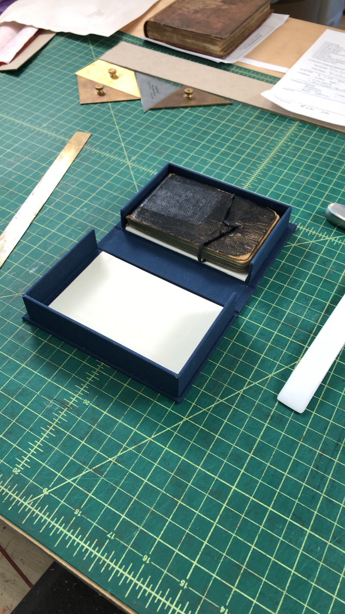 andrewhuot's tweet image. This WW I diary will be much happier in its own custom clamshell box. The client is coming tomorrow so I just have to add the label and it will be ready to go home. #clamshellbox #bookbinding #preservationenclosure #dropspinebox #bookarts