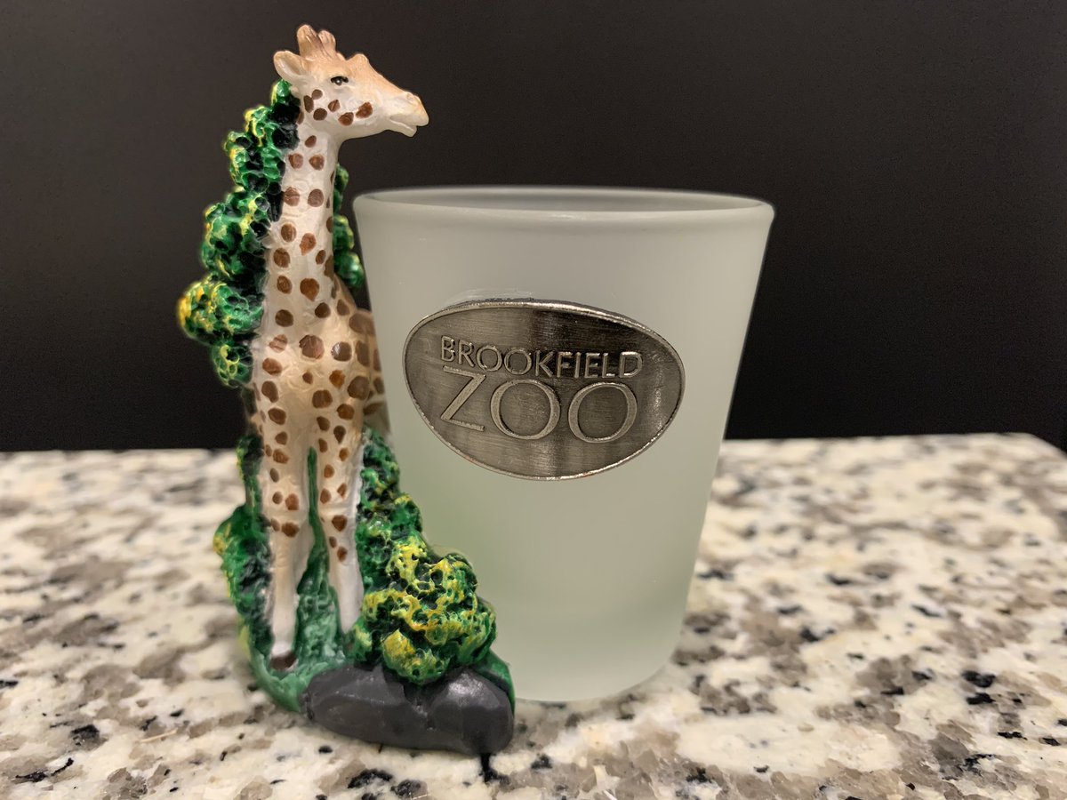 Day 19: In lieu of travel I’d like to do a tour of past trips via shot glasses. Fun family trip a few years ago to the Brookfield Zoo. I hold the giraffe when I drink from it.