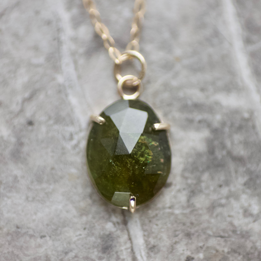 One Of A Kind olive green tourmaline, with loads of rainbow colour flashes, set in a triple prong, solid 9ct gold pendant. 

A little lockdown luxury 😍

#tourmaline #online #alwaysopen #winter #festive #olive #gold #jewellery  #oneofakind #christmasgift  #gift #lockdownluxuries