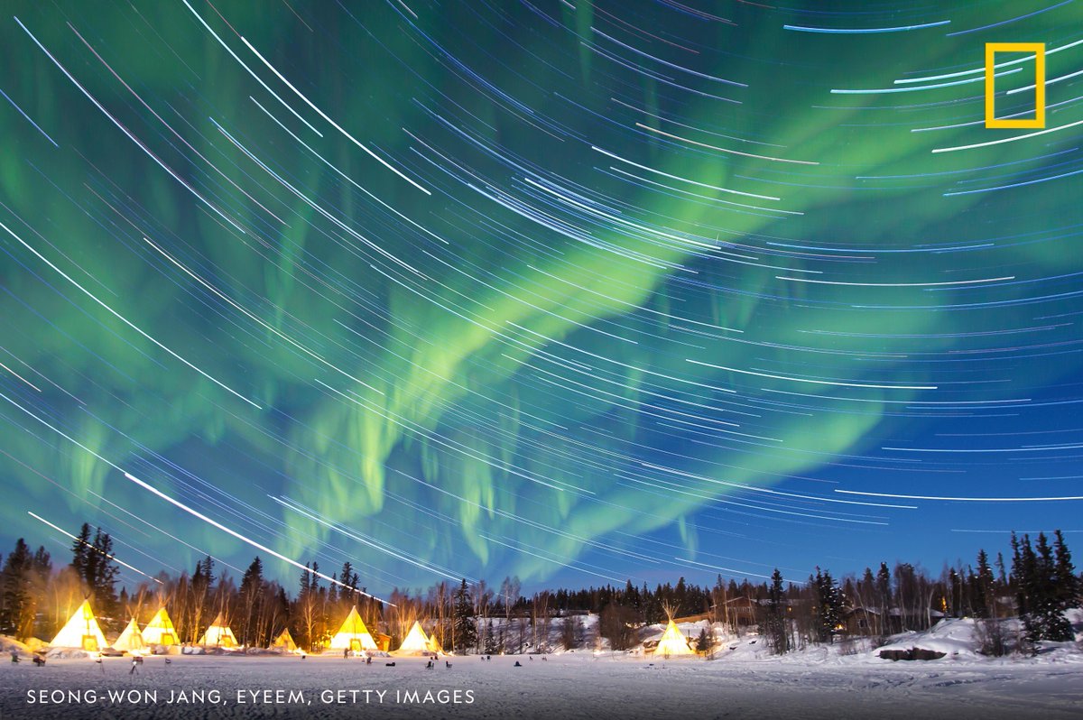 An aurora borealis swirls over Yellowknife, the capital of Canada's Northwest Territories. Read more about amazing places to inspire future journeys: #BestoftheWorld on.natgeo.com/331Vk3V