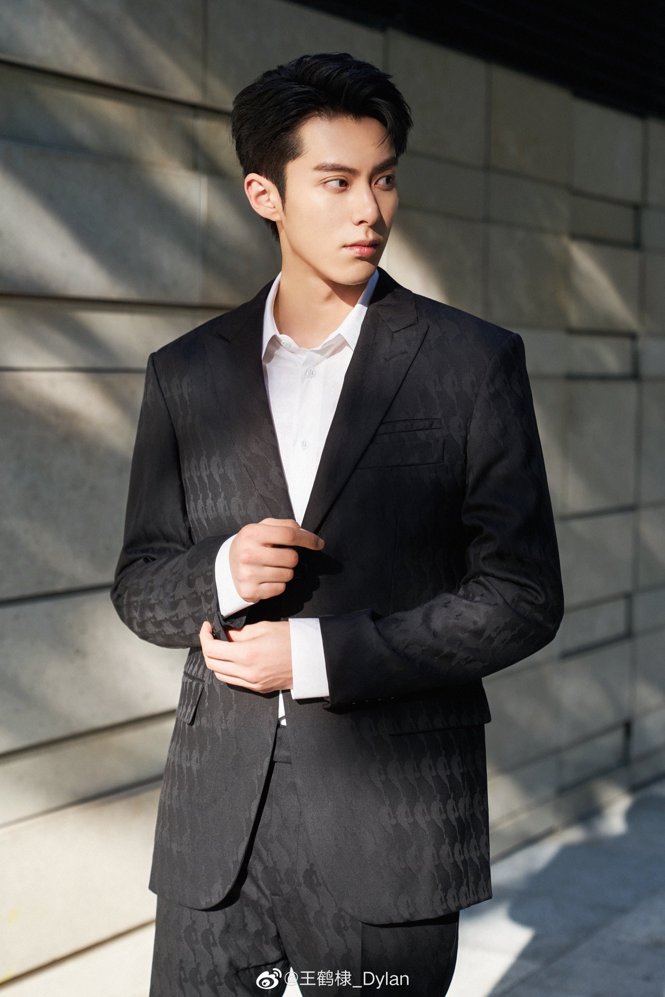 Dylan Wang wearing a Louis Vuitton Black Suit a style that very