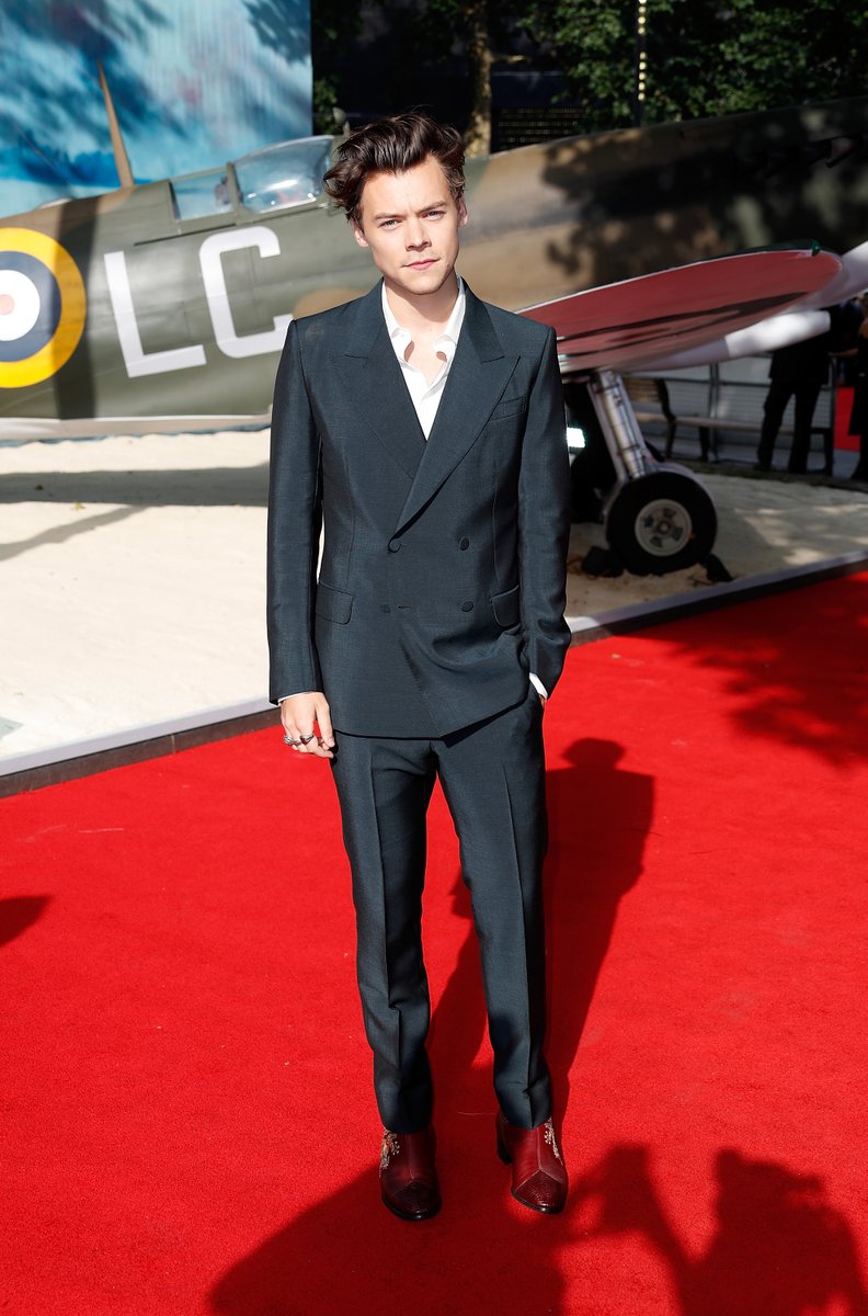 A double-breasted Harry Styles suit isn't quite rock 'n' roll Harry Styles, but the 'Dunkirk' actor's Cuban-heeled boots very much were.