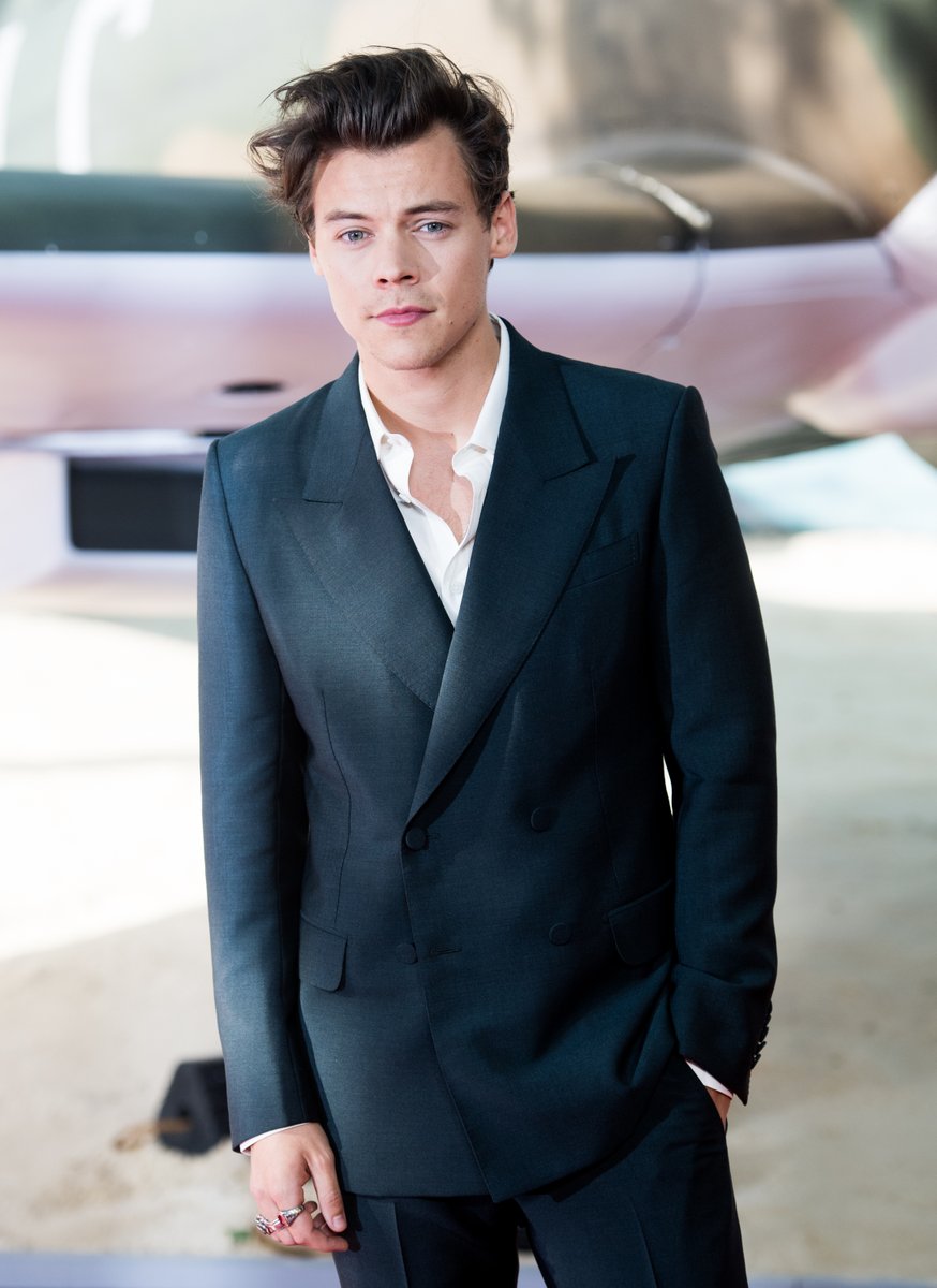 A double-breasted Harry Styles suit isn't quite rock 'n' roll Harry Styles, but the 'Dunkirk' actor's Cuban-heeled boots very much were.