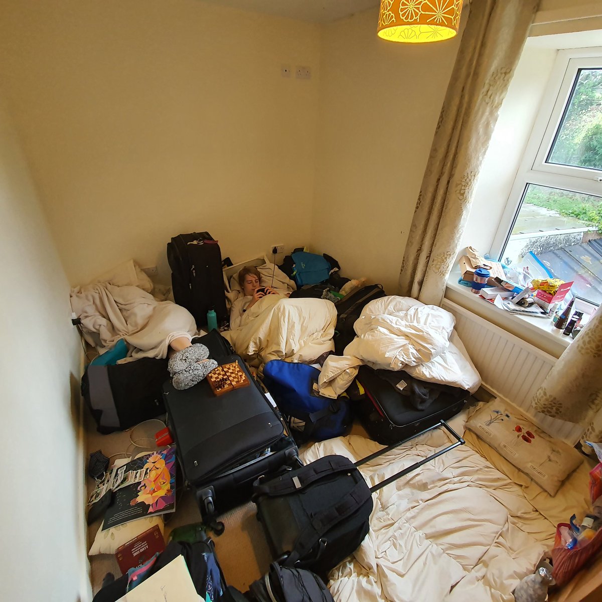 iles_art's tweet photo. My son still watching #desertbus surrounded by our luggage as all our possessions and pets 😢 are shipped off to New Zealand 
#DBTOME #neverstopwatching #charityfundraiser #DB2020 https://t.co/1rHJws3RY7